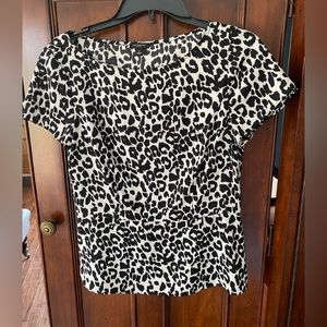 Ann Taylor black and white animal print top with peplum, size 6.